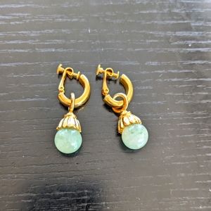 Gold tone drop dangle earrings with jade-like gem